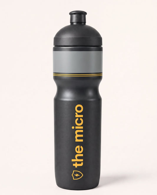 The Micro 400ml slim race water bottle, charcoal with gray band and yellow logo