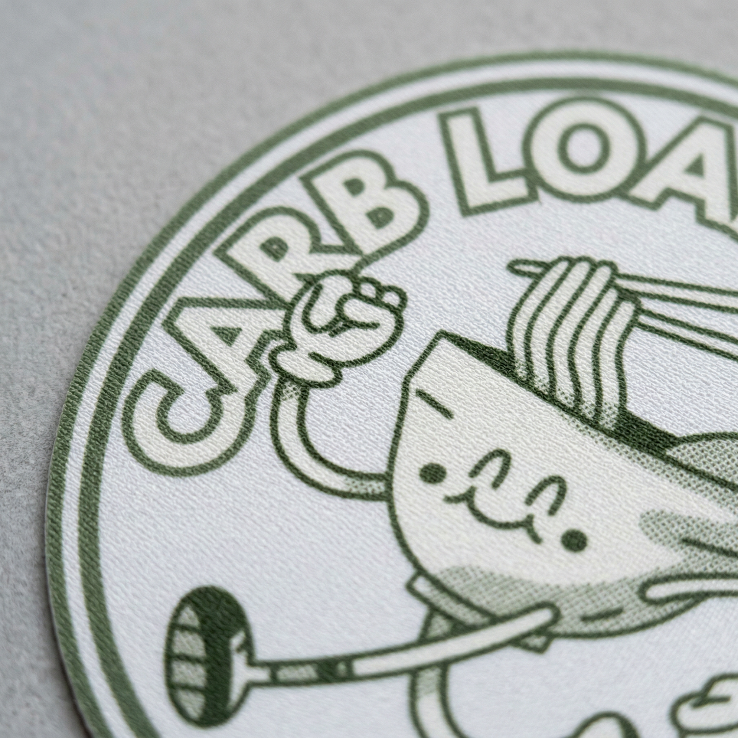 Illustration of a bowl of ramen with chopsticks and text 'CARB LOAD' on a gray background