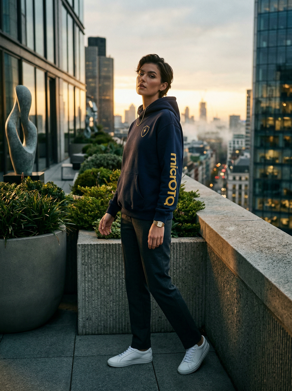 Person standing on a rooftop with cityscape in the background merch