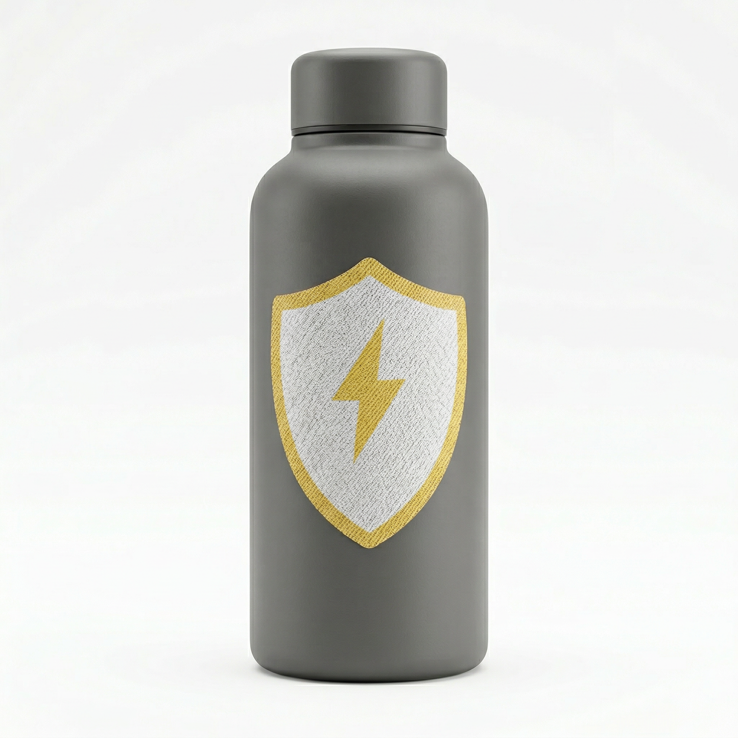 Gray water bottle with a shield emblem featuring a yellow lightning bolt on a white background